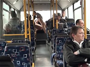 Lindsey Olsen plumbs her fellow on a public bus